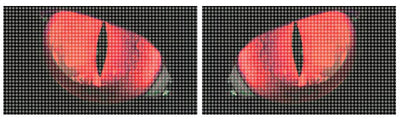 Close-up of red split teardrop headlight graphic decal on dark patterned background