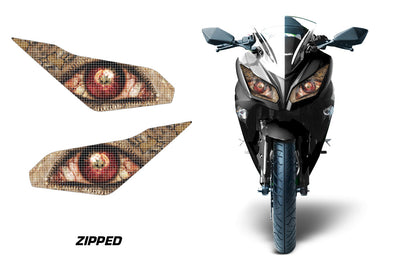 Motorcycle headlight graphic decals, black with zipped orange eye pattern (pair).