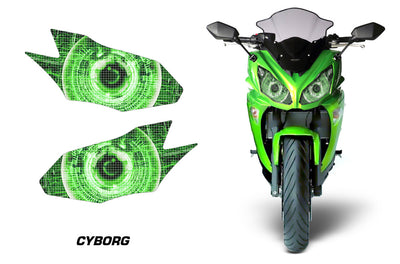 Headlight graphic decal set with two bright green cyber eye designs on a motorcycle front