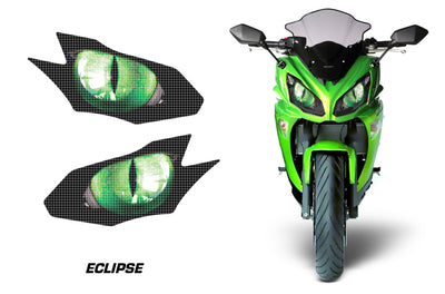 Headlight graphic decal set with glowing green eclipse eye designs on a motorcycle front