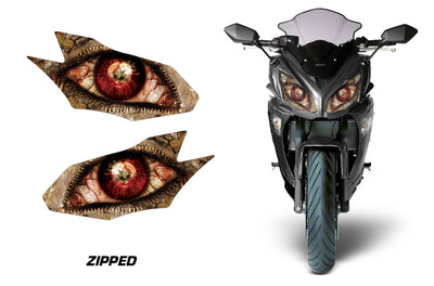 Headlight graphic decal set with brown cracked eye designs on a motorcycle front fairing