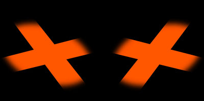 Orange headlight graphic decals with bold X-style pattern on both lenses