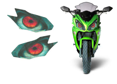 Pair of turquoise headlight decal panels with red eye-circle graphics