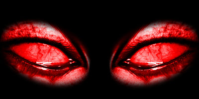 Pair of red eye-themed headlight graphics with black accents