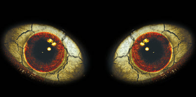 Pair of red and dark eye headlight graphics with cracked golden-yellow pattern