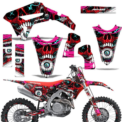 Off-road motorcycle graphics kit with pink and red skull decals for front and side panels