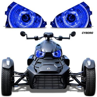 Headlight eye graphics with bright blue glowing concentric eyes on a Can-Am roadster front