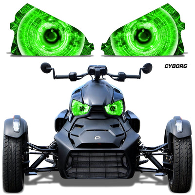Headlight eye graphics with neon green glowing concentric eyes on a Can-Am roadster front