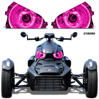 Headlight eye graphics with magenta/pink glowing concentric eyes on a Can-Am roadster front