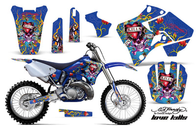 Blue motorcycle graphics kit with skull and text artwork, side panels, fork guards, front number plate
