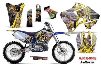 Yellow and purple motorcycle graphics kit with character artwork, side panels, fork guards, number plate