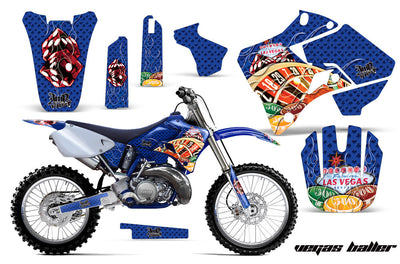 Blue motorcycle graphics kit with red character flames, side panels, fork guards, front number plate